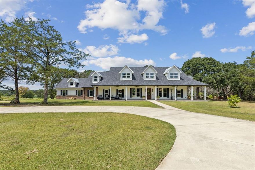 Discover this exquisite Farm and Ranch just 40 minutes from Dallas in Scurry, TX, where sprawling landscapes blend with luxurious living! The privacy of this property is unmatched. The quarter mile driveway through scenic woods is just the beginning. This property is well-suited for livestock, hay production, or future residential development with road frontage on FM 1388 and Shady Ln. Located less than 5 minutes from the shopping and residential development in Kaufman to include more restaurants and Lowe's. As you arrive in the home, you are invited by the expansive wrap around porches. Step inside to an inviting atmosphere with abundant natural light through large windows. The gourmet kitchen with central island, and butler's pantry with coffee bar, ensure that meal preparation becomes a delightful experience. Enjoy the convenience of a dedicated dining area, perfect for hosting dinners with scenic views of the surrounding countryside. The second living room off the kitchen can be used as a recreation room, music room, etc. The possibilities are endless. This house also features a 11X7 safe room that is tornado and fire proof. This home sits on an expansive plot, offering endless opportunities for agricultural pursuits or simply enjoying the open land, water views of the two 15 and 7 acre stocked lakes and two ponds, that is a fisherman's dream and picturesque sunsets.  Property does have agricultural exemptions as well.  The property has road frontage on FM 1388 and Shady Lane allowing multiple access points.  Don't miss out on the opportunity to call this estate home!  Owner also has a home on adjoining acreage that can be sold as well if looking for guest quarters or 2nd home on property.