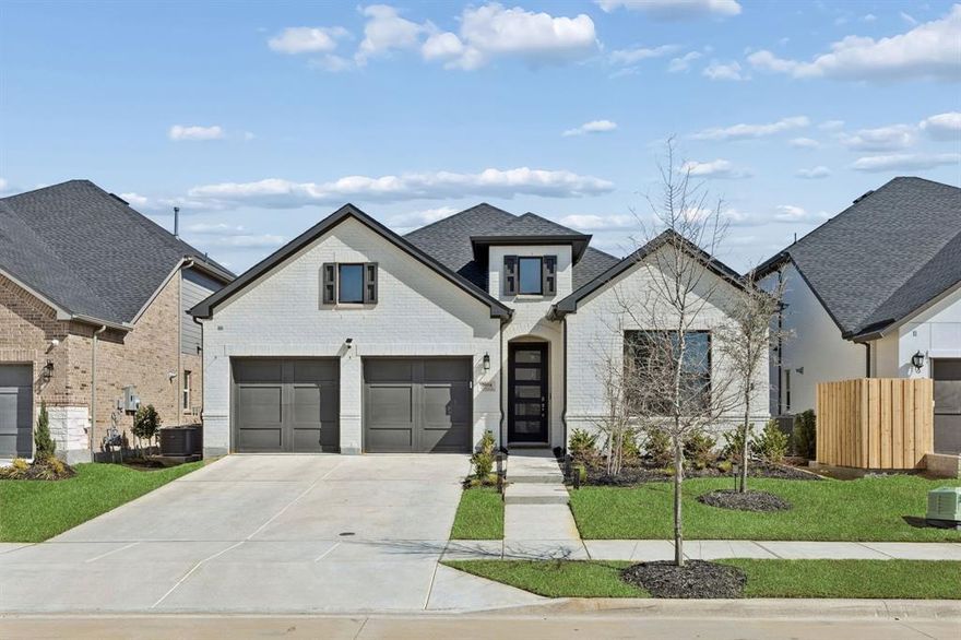 Welcome to 2058 Wimberley Drive in Prosper, located in the highly sought after Light Farms master planned community, where resort style living meets everyday comfort. This beautifully designed one story home is practically brand new and still covered under the builder warranty with Toll Brothers, offering peace of mind along with modern style and thoughtful upgrades throughout. The open concept layout creates a bright and inviting space perfect for entertaining or everyday living, centered around a stunning kitchen featuring Shaker style cabinetry, a beautiful accent color island, extended cabinetry flowing into the dining area, and upgraded countertops, tile, and flooring that bring a polished and cohesive look to the entire home. Designer lighting and additional recessed lighting elevate the space, while practical upgrades include epoxy floors in the garage, painted brick exterior with bronze window trim, and a convenient water softener loop in the garage. A full house water filtration system will convey, along with home security system equipment, adding even more value and convenience. The bathrooms are equally well appointed with stylish finishes and shower niches that add both function and design. Beyond the home itself, Light Farms offers an incredible lifestyle with five resort style pools, more than 240 acres of parks and green space, playgrounds, picnic areas, and over 13 miles of scenic walking and biking trails. Residents also enjoy Constellation Park with its dog parks, dog launch, and 11 acre lake, along with a fitness center and professional level sports courts including tennis, pickleball, basketball, bocce ball, and sand volleyball. The community even features an on site restaurant just minutes from your front door, making it easy to enjoy everything Light Farms has to offer. If you are looking for a home that feels new, offers incredible upgrades, and sits in one of Prosper’s most vibrant communities, this one truly stands out.