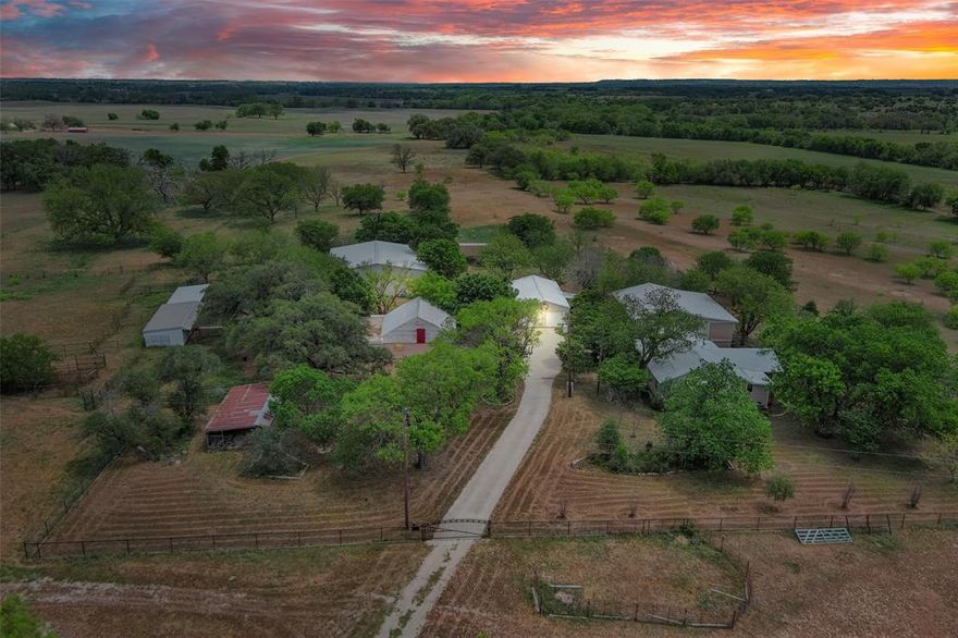 Don’t miss your chance to own the 293.404 acre Sawhorse Ranch. This estate features gorgeous open ranch land with rolling terrain, expansive views, abundant wildlife, along with mesquite trees, scattered oak trees, and various hardwoods. The 4700+ sqft home boasts 5 bedrooms and 5 baths. The original 1930’s farm house blends seamlessly with the two story addition built in 2000. In addition to the home, the property has a 24' X 48' detached garage with 5 rollup doors to store all your vehicles. The 60' X 54' insulated shop is divided into three spaces perfect for your workshop, farm implements, and office. The ranch has several other barns and outbuildings, including a large chicken coop. This property has paved road frontage on the west side and county road frontage along the north side. The ranch is centrally located between Austin, Dallas-Fort Worth, and Abilene. Bring your family and livestock and make this ranch your home among the central Texas rolling hills.