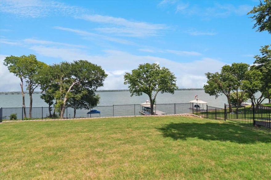 Stunning Lakefront Fully furnished Home on Wide Open Water with Panoramic Lake Views located in ROCKWALL COUNTY, ROCKWALL ISD! Property Features: Concrete retaining wall, concrete party pad overlooking the lake, pool w lake views, outdoor kitchenette w grill and refrigerator. The interior boasts spacious living w panoramic lake views from the plentiful windows found throughout the home, allowing tons of natural light to shine through. The huge island kitchen with plentiful cabinets and a walk-in pantry is sure to be a delight for the chef in the family. The primary suite is located upstairs, boasting a WIC, dual vanities, a separate shower, and a jetted tub. Conveniently Located within 15 minutes of PGBT and I-30 for all of your traveling needs.  House comes with furniture, refrigerator, washer and dryer.