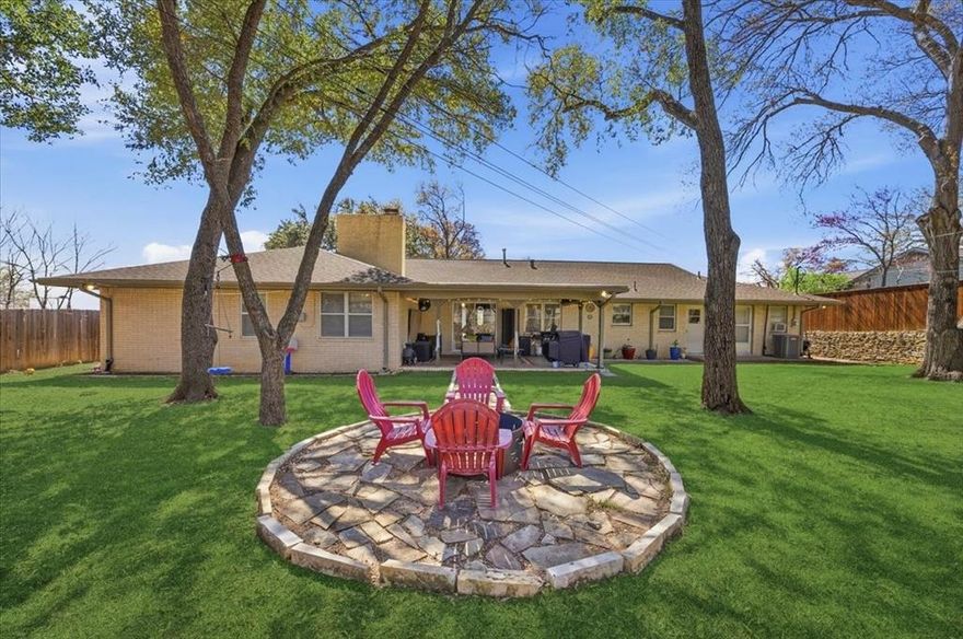 Nestled in the heart of Ridglea Hills, this classic ranch-style home captures the timeless charm and livability the neighborhood is known for, thoughtfully paired with meaningful updates throughout. With its welcoming presence, functional layout, and a location just moments from the neighborhood park and Ridglea Hills Elementary, the home offers a rare combination of character, comfort, and everyday convenience.

Inside, the home opens to a light-filled formal living and dining space just off the entry, where large windows overlook the covered front porch and charming porch swing, filling the space with natural light. The heart of the home unfolds into a comfortable living area anchored by a brick fireplace and a wall of built-ins, seamlessly connected to the kitchen and breakfast area.

The primary suite offers a unique bonus with an attached flex room, ideal for a private office, nursery, or quiet retreat. Three additional guest bedrooms are generously sized and share a fully updated guest bath. The home continues to impress with a large utility room featuring a sink, half bath, and abundant built-in storage. An attached workshop space off the garage provides even more versatility for hobbies, projects, or additional storage.

Step outside to a spacious, tree-shaded backyard designed for both relaxing and entertaining, complete with a covered patio and outdoor fireplace that creates a natural gathering space year-round. With plenty of room to play, host, or unwind, the backyard offers a private and inviting extension of the home.