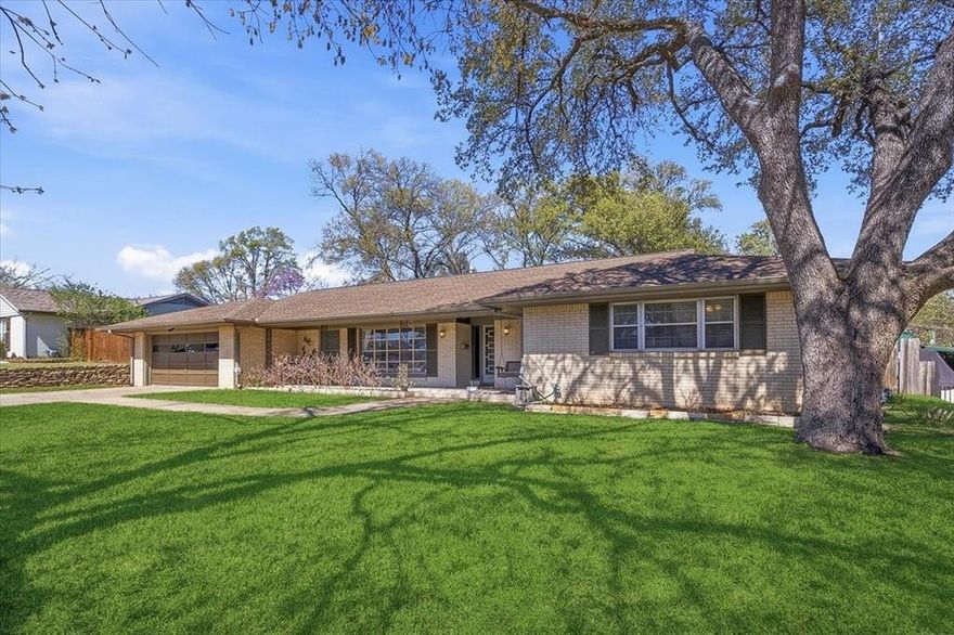 Nestled in the heart of Ridglea Hills, this classic ranch-style home captures the timeless charm and livability the neighborhood is known for, thoughtfully paired with meaningful updates throughout. With its welcoming presence, functional layout, and a location just moments from the neighborhood park and Ridglea Hills Elementary, the home offers a rare combination of character, comfort, and everyday convenience.

Inside, the home opens to a light-filled formal living and dining space just off the entry, where large windows overlook the covered front porch and charming porch swing, filling the space with natural light. The heart of the home unfolds into a comfortable living area anchored by a brick fireplace and a wall of built-ins, seamlessly connected to the kitchen and breakfast area.

The primary suite offers a unique bonus with an attached flex room, ideal for a private office, nursery, or quiet retreat. Three additional guest bedrooms are generously sized and share a fully updated guest bath. The home continues to impress with a large utility room featuring a sink, half bath, and abundant built-in storage. An attached workshop space off the garage provides even more versatility for hobbies, projects, or additional storage.

Step outside to a spacious, tree-shaded backyard designed for both relaxing and entertaining, complete with a covered patio and outdoor fireplace that creates a natural gathering space year-round. With plenty of room to play, host, or unwind, the backyard offers a private and inviting extension of the home.