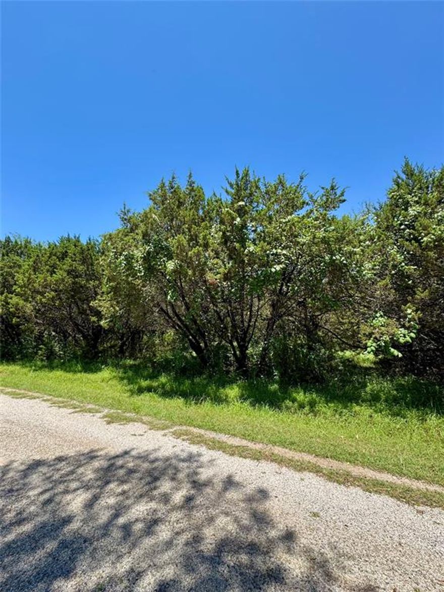 This beautiful property is located in White Bluff Resort. The double lot includes 39279 & 39280 Cedar Park Dr. White Bluff is the place to be.  Nestled within a secure gated community, White Bluff Resort boasts the breathtaking Lake Whitney, known as one of Texas, most picturesque lakes. Indulge in the resort's exceptional amenities, including two 18-hole golf courses, four swimming pools, enticing restaurants, tennis courts, playgrounds, parks, marina, volunteer fire department, conference center, and even a hotel. All amenities transfer with sale of property. 72 rounds of golf a year come, excluding cart come with the property. Deer and wildlife add to peace and serenity that are unique to this RELAXED RESORT LIFESTYLE.