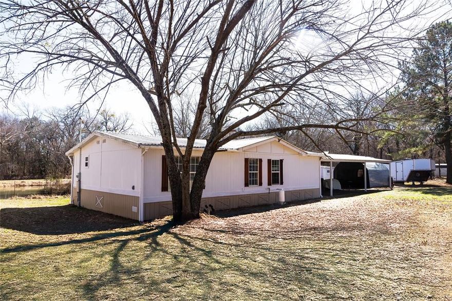 Enjoy peaceful country living with this 2 bedroom, 2 bath manufactured home situated on 2.23 acres, featuring a private pond with turtles and bass. Deer have been seen on tge property. There are rose bushes on the front gate. Property also has fruit trees. Surrounded by open space and natural beauty, this property offers the perfect blend of tranquility and convenience. Located in the Sam Rayburn ISD and just minutes from multiple lakes, it is ideal for outdoor enthusiasts who enjoy fishing, boating and quiet evenings under the stars. With ample room for animals, gardening or future improvements, this property offers endless possibilities.  Stove operates with propane.  Property features a workshop with screened porch. Buyer and or buyer's agent to verify any and all information. MOTIVATED SELLERS! Home selling as-is.