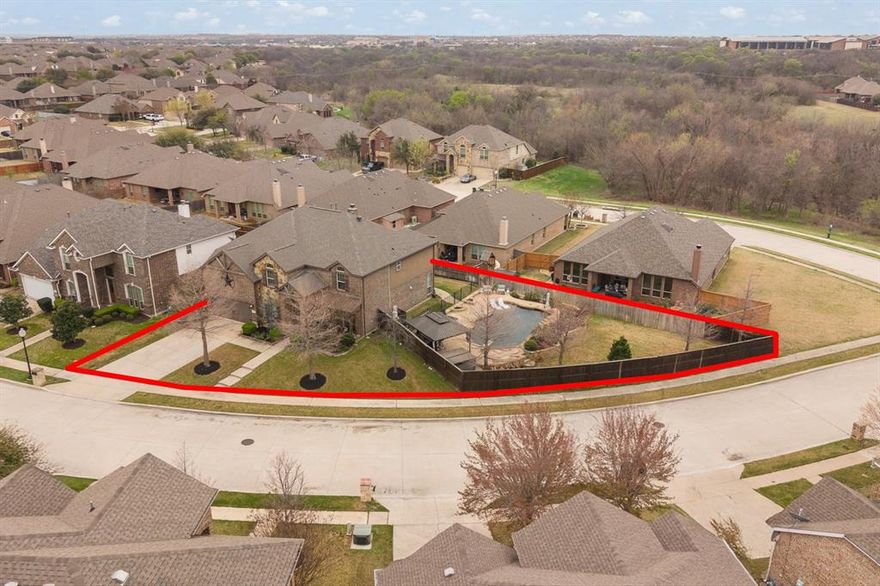 Rare opportunity! Located in the gated community of Santa Fe Enclave and zoned to highly sought-after Keller ISD. This stunning 5-bedroom, 4.5-bath home sits on a rare double lot and offers the perfect blend of luxury, space, and functionality. Designed with an open-concept layout, the home is filled with natural light, highlighted by floor-to-ceiling windows that overlook the backyard oasis. The beautifully designed kitchen is a true centerpiece of the home, featuring a gas cooktop, ample counter space, and a layout that opens seamlessly to the main living area—perfect for both everyday living and entertaining. The thoughtfully designed floor plan includes a private home office, spacious game room, and a dedicated media room, giving everyone their own space to work, relax, or gather. Step outside to your personal retreat where you'll find a resort-style pool, pergola, and outdoor fireplace with a comfortable sitting area, creating the ultimate setting for entertaining or unwinding at the end of the day. With generous living spaces inside and out, this home offers a rare opportunity to enjoy luxury living on an oversized homesite in one of Fort Worth’s most desirable gated communities.