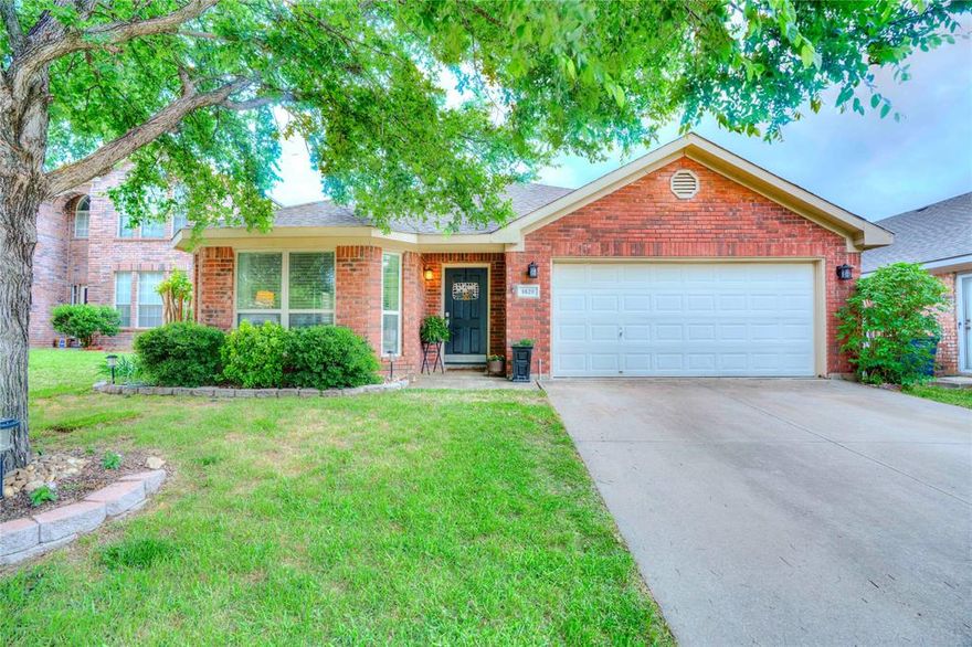 Welcome to this warm and inviting 4-bedroom, 2-bath home with a 2-car garage, perfectly situated in the heart of the DFW Metroplex. Located in a friendly, established neighborhood with sidewalks and a peaceful community pond, it’s the kind of place where evening strolls and neighborly waves feel like home. Inside, you’ll find a spacious and flexible layout with two living areas and two dining spaces—ideal for hosting family gatherings or simply enjoying everyday life. The open-concept family room and kitchen create a comfortable hub for connection and entertaining. The primary suite offers a relaxing retreat with dual sinks, a separate shower, and a jetted tub perfect for unwinding at the end of the day. Step outside and picture yourself sipping your morning coffee on the covered patio or firing up the grill for a weekend barbecue in the fenced backyard, shaded by mature trees. Whether you're entertaining guests or enjoying a quiet evening, this outdoor space is made to be enjoyed. With highly regarded HEB ISD, easy highway access, and a convenient location near Arlington, Fort Worth, and DFW Airport, you’ll love how effortlessly you can get wherever you need to go while still enjoying the comfort of home.