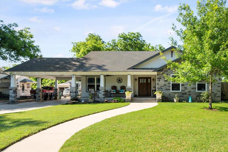 This is a Beautiful craftsman style home full of character, timeless wood trim details, and gorgeous curb appeal just minutes from west 7th, the stockyards and Trinity river. Perfect location and right in the middle of the hustle and bustle of what everyones loves most about Fort Worth Texas!

From the moment you arrive, the large covered front porch, detailed exterior architecture, and porte-cochère create a warm and inviting first impression while providing covered access that leads to the rear garage and workshop spaces.

Inside, you are welcomed by a beautiful open foyer overlooking the large living and dining spaces. 
Throughout the home, you’ll find beautiful woodwork, detailed trim casings, and craftsmanship that give the home so much character.

This home has 3 beds, 2 baths, a large open living and dining space, large open kitchen, sunroom, huge grassy backyard, 2 car garage a shed and 2 workshop areas with AC and Electricity.

The Primary Suite is divided into 2 spaces. The entry or sitting area which then steps down into the bedroom. The Bathroom is off the entry of the Primary.
The recently renovated kitchen features high end appliances, beautiful cabinetry, abundant storage and overlooks dining room.

Just off the kitchen, a few steps lead down into a large sunroom with wall to wall windows and a wet bar which looks out into the fully fenced backyard with an expansive flat grassy area and direct access to the workshop buildings.

Attached to the garage is approximately 693 square feet of workshop space with HVAC and electricity, divided into two separate work areas for flexibility and functionality. An additional outbuilding with electricity provides even more workspace or storage options.

Windows, plumbing, and electrical wiring have all been replaced as well as the entire kitchen recently renovated. 

Seller is planning to sell majority of furniture in the home. Please see additional documents in transaction desk for more details.