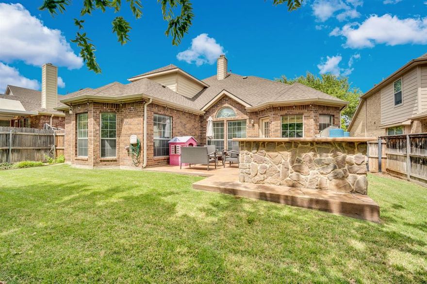 Beautifully updated 5 bedroom home in sought after Heritage Subdivision and Keller ISD with walking distance to Lonestar Elementary!  Open floor plan with soaring ceilings, stone fireplace completely updated kitchen and dining adding a modern touch to the space.  The downstair primary bedroom has a fully updated ensuite bath and views of the backyard from the expansive windows.  Hard to find second downstairs bedroom with a full size bath is perfect for guest or an in-law suite!  Travel upstairs to the huge flex space with 3 more spacious bedrooms and bath, plenty of room for everyone!  End your tour in the private backyard with built in BBQ and island great for entertaining!  The community features resort-style pools, splash pad, clubhouse, tennis courts, fishing pond, playgrounds and walking trails. Like living in a resort!!
