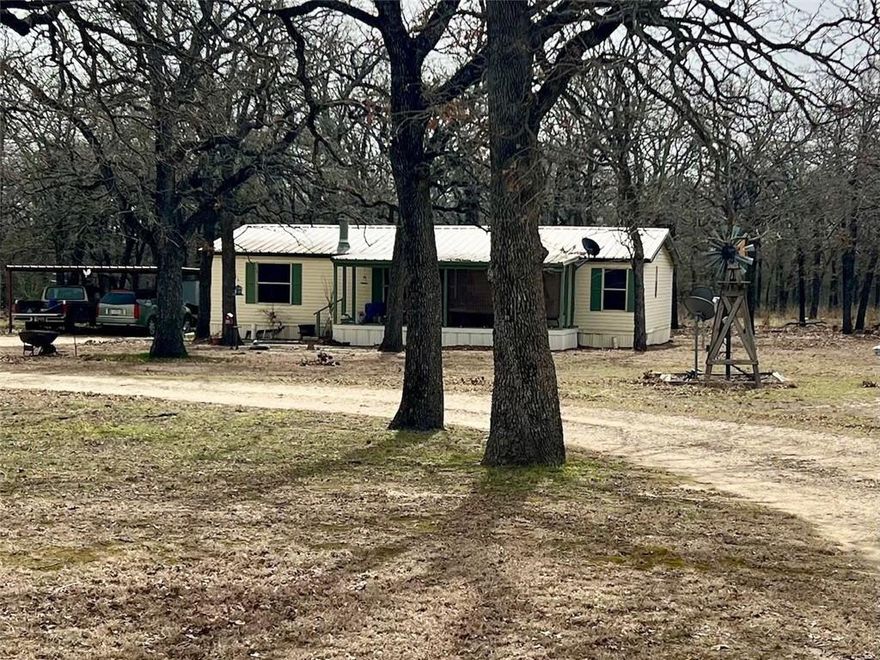 Looking for that little house out in the country, this is it. Double Wide mobile home on 7.4 acres in Riesel Tx. Property is covered with mature Post Oak trees. 30 x 50 metal barn with power and water. Home has 3 bedrooms and 2 baths with a large family room and metal roof. Big porch front and back of home.