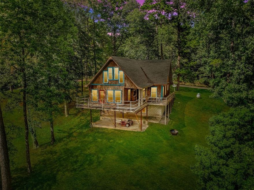 Perched high on a hill overlooking the sparkling waters of Lake Claiborne, this one-of-a-kind custom-built home offers endless potential for lake living at its finest. With a little TLC, this unique property could become the ultimate retreat—whether you’re searching for a weekend camp, a family getaway, or a full-time lake residence.

Step inside to find an inviting open-concept living, dining, and kitchen area with soaring ceilings, detailed woodwork, and abundant natural light. A loft bedroom with its own bath provides a cozy retreat, while the full basement—already 80% finished—features a wood-burning stove, additional living space, and a covered patio perfect for relaxing after a day on the water.

Enjoy breathtaking sunset views from the expansive deck just off the living room, an ideal spot for entertaining guests or simply unwinding at the end of the day. For boating and fishing enthusiasts, the property includes a two-stall boathouse with a sun deck that’s perfect for casting a line, lounging in the sun, or launching into an afternoon of fun on the lake.

Opportunities like this are rare—priced below appraisal and waiting for your vision. With its elevated setting, unique design, and direct lake access, this property is your chance to create lasting memories and enjoy everything Lake Claiborne has to offer.