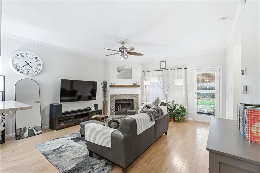 Rare urban oasis featuring a private, oversized fenced backyard with a covered porch and storage shed—a standout find for this community! This move-in-ready end unit boasts a high-efficiency HVAC (2021) and seamless bamboo flooring throughout. It has an airy, open-concept layout. The inviting living area centers around a cozy wood-burning fireplace framed in beautiful stones, perfect for relaxing evenings. The modern kitchen shines with granite countertops, a breakfast bar and Frigidaire appliances, while the dual primary floor plan offers maximum privacy with each bedroom featuring its own walk-in closet and full ensuite bath, including a luxurious jetted tub in the main suite. PLUS, the washer, dryer & refrigerator will remain!Unmatched convenience includes a secure, attached one-car garage with direct kitchen entry, overhead custom wood storage. Perfectly positioned directly across from the sparkling community pool and lush green space. The comprehensive HOA covers water, sewer, trash, roof and exterior maintenance for stress-free living. To make your transition even smoother, the seller is providing professional move-in cleaning and assistance toward closing costs! Best condo in the complex for the money.