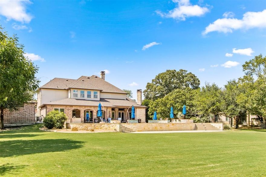 Beautiful CUL-DE-SAC HOME easy WALKING DISTANCE to the Cotton Belt Trail, Colleyville Elem and Middle Schools, past horses and a Red Caboose. 

Spacious FAMILY ROOM w soaring 12’ ceilings connects to a GOURMET KITCHEN with professional range, 4 ovens & warming drawer includes expansive island to serve holiday meals on.

3 1ST FLOOR BEDROOMS and 2 up create flexibility for younger kids and older guests. Oversized bedrooms keep everyone from fighting about which one is bigger.

GUEST RETREAT upstairs w french doors has 2 ensuite bedrooms, wet bar and huge GAME & MEDIA rooms.

The DEEP COVERED PORCH w 10’&12' ceilings will keep you outdoors watching TV, enjoying a roaring fire & dining. Patio leads to a beach entry pool and oversized spa. GAS FIRE PIT for S'mores and watching kids' soccer in spacious backyard.

Beautiful GAME ROOM-FLEX GARAGE w glass garage door overlooks TRUE BEACH ENTRY POOL-cedar ceiling, brick wall and finished floors & 220v plug. R-40 zoned for horses.