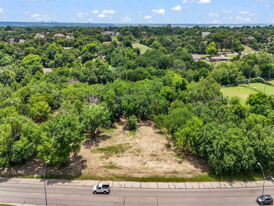 Approximately 195 feet of Road Frontage on Jacksboro Highway. Sky's the limit with this extremely high traffic location in an up and coming area between Sansom Park and Fort Worth-River Oaks, located directly on 199 Jacksboro Hwy. This parcel of land to be sold with 5001 Jacksboro Hwy MLS#20645928.
