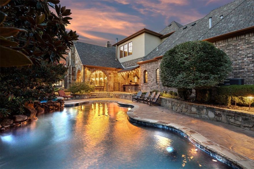Situated on a .940 acre lot within a neighborhood setting, this custom-built, original-owner estate offers 7,339 square feet of refined living across two levels. Designed with architectural distinction and exceptional craftsmanship, the home features six ensuite bedrooms and two additional powder bathrooms. The stone-accented foyer with brick groin vault ceiling opens to a courtyard with gas fireplace and iron security gate. Six fireplaces are thoughtfully placed throughout the home. The family room showcases a cathedral ceiling with exposed beam accents, built-in cabinetry, custom mantel, and a wine cellar with refrigerator. The kitchen is appointed with granite countertops, 48-inch Thermador gas range, double ovens, built-in refrigerator , pot filler, copper apron-front double-basin sink, under-cabinet lighting, built-in desk, and walk-in pantry. The owner’s suite features a vestibule entry with dome ceiling and mosaic tile medallion, tray ceiling with accent lighting, elevated sitting area with fireplace, French doors to the patio, dual vanities, jetted tub, walk-through shower with rainhead, custom closet system, travertine tile, and spiral staircase access to the gym.Additional highlights include a private office with beam ceiling and built-ins, formal dining with groin vault ceiling, game room and upstairs living area with kitchenette, gym with sauna and cold plunge installed 2025, two laundry rooms, fire suppression sprinkler system, two, and Class IV roof installed 2022. Outdoor living is designed for recreation and entertaining with a salt play pool, pickleball court, imported Italian pizza oven, built-in grill, gas firepit with pergola, mosquito misting system, and large covered patio. Mature landscaping enhances privacy and large grassy area give plenty of room to play. The attached four-bay garages includes a 30 x 21 three-car bay and a 25 x 13 single bay with 8 foot 9 inch door height, dog wash with slider containment door, and pot filler plumbing.