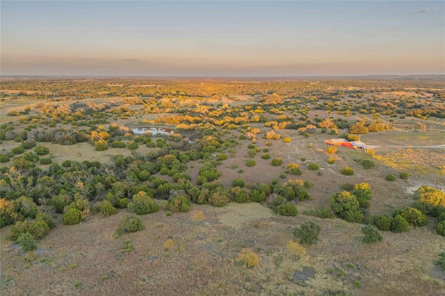 257 acres located off FM 573, approximately 9 miles south of Comanche, Texas. The property includes a 1,880 sq ft 2-bed,2-bath barndominium with new HVAC and a whole-house water-treatment system by Nations Pure. A 30×40 (1,200 sq ft) shop with a 20×40 eave overhang provides excellent storage or workspace. Accessed by an improved road system with culverts, the ranch features a gated entrance with an automatic gate opener.

Rolling topography, mature oak trees, native grasses, a seasonal creek, and a stocked pond highlight the land’s diverse natural features. Extensive brush management has been completed, including cedar and prickly pear removal. Wildlife is abundant, with white-tailed deer, turkey, and feral pigs commonly seen.

Located in the western Cross Timbers region near the Hill Country, this multi-use property is well-suited for hunting, ranching, or recreation. The combination of infrastructure, water features, and habitat diversity makes this an exceptional all-around ranch in Comanche County.