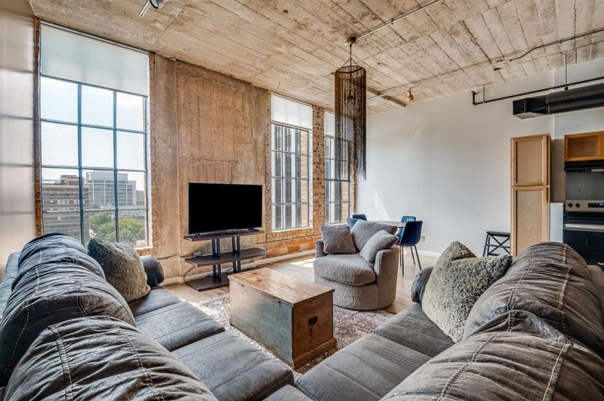 Rare, fully furnished unit for Lease! This beautifully updated, west-facing apartment offers stunning views of the Omni Hotel, Reunion Tower, Margaret Hunt Hill & McDermott Bridges, and the historic Dallas County Courthouse. Fully furnished, the unit includes a queen bed, sectional couch, TV, dining set, standing desk, washer & dryer, and more—just move in and enjoy. Recent upgrades include a new HVAC system, appliances, vanity sink, toilet, flooring, and fresh paint. Enjoy hardwood floors, high-speed WiFi (included), gated garage parking, and all utilities covered (water, trash, WiFi). Building amenities include a gym, rooftop pool, 24-7 concierge & security, and Friday popcorn. Located steps from the AT&T Discovery District, Klyde Warren Park, the Dallas Museum of Art, and more, with movie nights, Cowboys watch parties, and even winter ice skating just an elevator ride away. Check it out before it's gone!