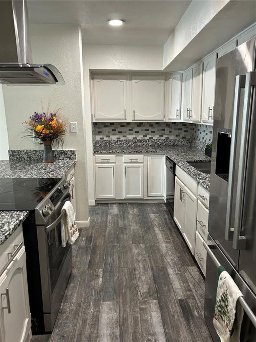 Charming and beautifully updated home situated on a desirable corner lot in Arlington! This well-maintained 3-bedroom, 2-bath residence offers a functional split-bedroom layout and tasteful updates throughout. The inviting living area features updated flooring that flows seamlessly through the home. The kitchen is a delight with granite countertops, stainless steel appliances, and ample cabinet space. Both bathrooms have been stylishly remodeled with modern finishes. Additional highlights include an epoxy-coated garage floor, a spacious 2-car garage, and great curb appeal. Built in 1983, this home combines classic character with contemporary comfort — move-in ready and perfectly located near schools, parks, and shopping!