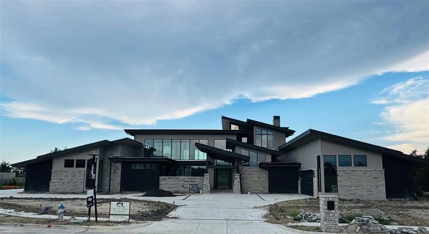 SEARCH ALL of DFW & then come MARVEL at this SPECTACULAR (Aspen Inspired) masterpiece on 1 Ac that backs to a private community lake surrounded by other multi-million $$ estates in DFW’s BEST KEPT SECRET….HEATH TX. Nearly 7000SF of awe-inspiring architectural wonder! In order to carry the breathtaking open spans & ceiling angles & heights the architect employed commercially designed steel beam construction to make this one like no other! Truly Indescribable!! 5 Bedrooms (4 ensuites on 1st level), Private Casita, 4 Car oversized garage, Front Courtyard, Interior Open Courtyard (center of home), huge Lanai, Massive Kitchen with Catering or Prep Kitchen, 20x18 Gameroom up opens to 17X10 Covered Balcony all overlooking the unbelievable setting.