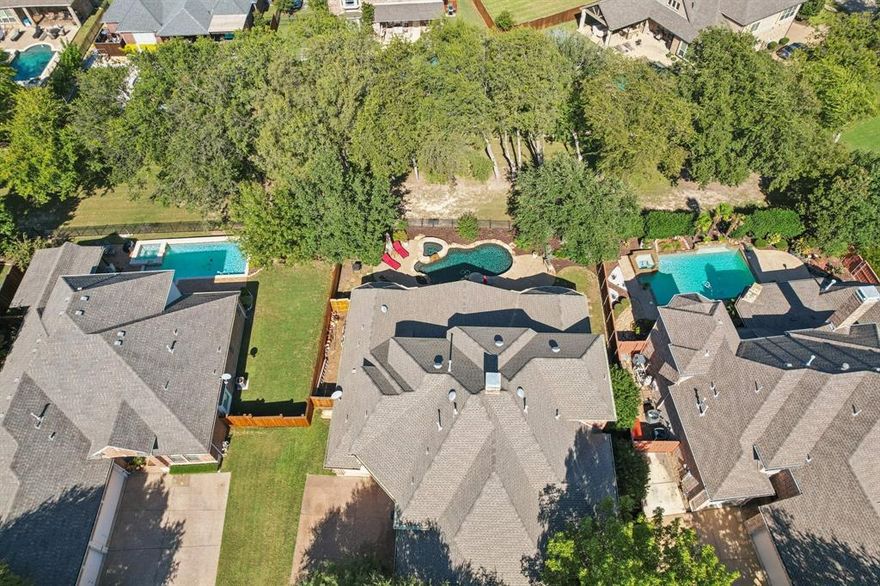 Stunning residence with pool, outdoor living room, just updated master bath, study, media room, game room, and access to the community Beach Club. This 4,510 sq. ft. home is in Stratford Manor, a crown jewel of Stonebridge Ranch. As you enter the home, you'll find an impressive curved staircase and formal – but comfortable – living and dining spaces. Thoughtfully planned kitchen features granite countertops, an oversized island, built-in refrigerator, butler’s pantry, and walk-in pantry. The attached full-size breakfast area has sunny windows. Family room has a gorgeous fireplace and views of the backyard retreat. The luxurious primary suite offers recent renovations with a freestanding soaking tub, dual sinks, quartz counters, and frameless glass walk-in shower with penny tile flooring, and porcelain tile. Enjoy 4 spacious bedrooms—all with ensuite baths. Step outside to a sparkling heated saltwater pool and spa, water feature, built-in grill, and covered patio with fire pit—ideal for outdoor gatherings year-round. Additional features: 3-car garage, wood and tile flooring, decorative lighting, sound system wiring, and full sprinkler system. This home is a Sanders-Huntington custom build that blends elegance, comfort, and lifestyle in one perfect package. Located adjacent to a greenbelt in the heart of Stonebridge Ranch, residents enjoy access to lakes, parks, pickleball and tennis courts, walking trails, and community pools. Conveniently close to McKinney ISD schools, shopping, dining, and major thoroughfares.