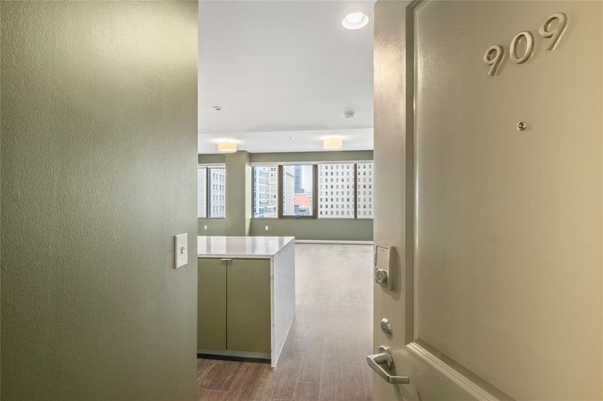 Welcome home to downtown living at 1200 Main Street. Perched on the 9th floor, this inviting 2-bedroom, 2-bath condo offers the perfect blend of comfort, style, and the energy of city life right outside your door. Natural light fills the open living and dining space, creating a warm and welcoming atmosphere that’s perfect for relaxing at home or hosting friends before a night out in the city.

The thoughtfully designed layout offers privacy with two spacious bedrooms, including a primary suite with its own private bath and ample closet space. The second bedroom works beautifully for guests, a home office, or both—giving you flexibility to make the space your own.

Located in the heart of downtown Dallas, you’ll love being just steps away from restaurants, coffee shops, entertainment, and everything that makes city living so exciting. Whether you're enjoying the skyline views from the 9th floor or heading out to explore the neighborhood, this condo makes it easy to experience the best of Dallas living every day.