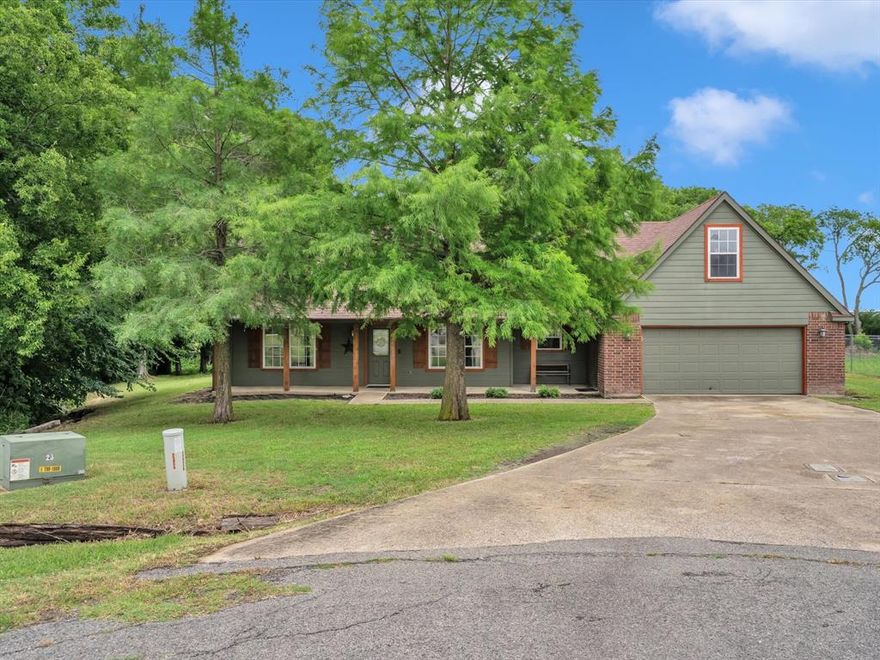 Peaceful Rural Setting on Tree Lined Cul De Sac Lot in Nevada, TX! Greeted w Mature Trees, Covered Front Porch perfect for Watching the Sunrise w Morning Coffee & Sunset w Evening Libation. Laminate Wood Flooring throughout Living Areas, Study w French Doors off Entry, Living Room w Vaulted Ceilings & Wood Burning Fireplace...Open to Nook & Kitchen that Offers Ample Counter Space & Cabinet Space. Secluded Owners Retreat w Ensuite Bath...Dual Sinks, Updated Walkin Shower & Walkin Closet. Split Bedroom Floorplan w 2 Secondary Bedrooms & Full Bath. Entertain the Kiddos Upstairs w a Spacious Gameroom ideal for Tucking Away All the Toys & Noise from the Main Living Area. Beautiful Covered Back Porch onlooking Tree Line adding Privacy & Ambiance of Nature w Birds Chirping. Storage Building a Perk for Storing All Your Lawn & Gardening Tools, or Man Cave for Wood Working. Minutes from Lake Lavon...Boat Ramps, Fishing & Hiking. Easy Access to 78, Rockwall & George Bush. Lil Piece of Paradise Outside the City Limits!