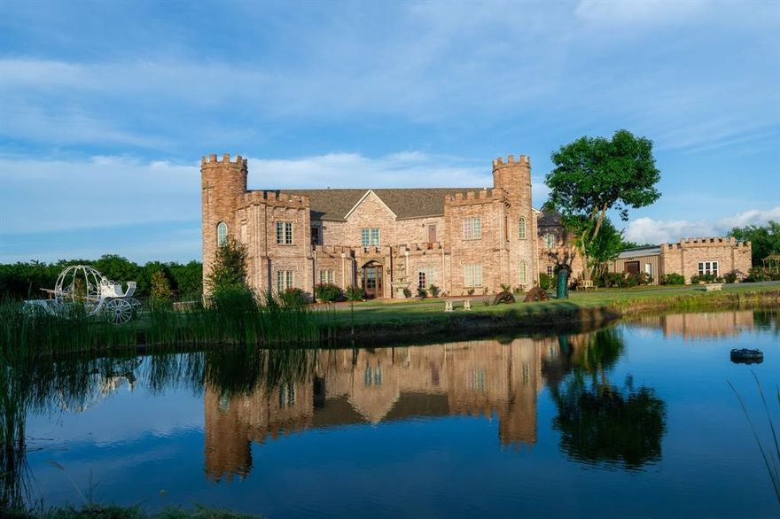 Live in a private, castle-themed estate that can pay for itself with its wedding & event venue. A replica Irish castle serves as the centerpiece, offering 5,624 sq ft of luxury. This home boasts 8 bedrooms (mostly en suite), a formal living room, Great Room, stunning kitchen, and home theater. It also includes a gym, dog run, two laundry rooms, and a full apartment for relatives or staff. Situated on 10.33 ag-exempt acres with no neighbors nearby, it's just 4 miles from I-30 and 40 minutes from downtown Dallas. Exterior amenities include a 30'x50' workshop, 30'x30' enclosed barn, tree-lined trail, 2-car garage, 4-car carport, 32KW solar array, and 5 rainwater tanks supplying 43,000 gallons of filtered water. The on-site, castle-themed wedding & event venue measures 3,600 sq ft, seats 150 guests, and has parking for 100 cars. Its stellar reputation is backed by near-perfect reviews online. Custom-made imported furniture, as shown in the pictures, is included.