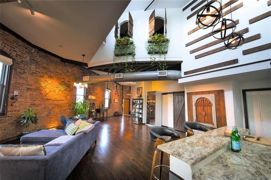 Description: A rare opportunity to live and work in a fully renovated dual purpose condo in the Cedars! This historic loft will capture you with its high ceilings, beautiful pine floors across wide open spaces, and original exposed brick and beams. Newly installed custom lighting, en suite sauna, and its own 600+ sqft. private rooftop terrace which offers some of the best panoramic southside views of the downtown Dallas skyline. These dual use condo's can be used for residential and or commercial purposes. The 12 unit complex features a community grilling and picnic area, fire pit, and large, fenced-in greenspaces with mature trees and on-site parking.