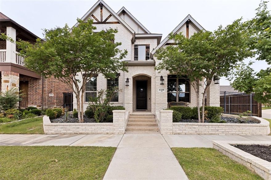 Situated on a landscaped corner lot in Arlington's highly sought-after Viridian community, this thoughtfully designed home blends functional space with a true lifestyle experience. The inviting open-concept layout is highlighted by soaring vaulted ceilings and decorative lighting. The kitchen is the heart of the home with quartz countertops, an island, gas cooktop with vent hood and walk-in pantry. A dedicated study with hardwood flooring and built-ins offers the perfect work from home setup, while a secondary bedroom also downstairs provides flexibility for guests or multigenerational living. Motorized shades add a layer of convenience and sophistication, while built-in wiring for flat screen TVs and surround sound ensures the home is ready for a modern lifestyle. The primary bedroom has a sitting area and en-suite bathroom with an upgraded rain showerhead and walk-in closet. Additional thoughtful touches include a storage closet tucked under the stairs and a bonus extended concrete pad to park a third car for added functionality or hobby space. Located in the unmatched master-planned community of Viridian, residents enjoy a true resort-style lifestyle with access to multiple pools, five lakes, Sailing Center, Lake Club, miles of scenic trails, parks, tennis and pickleball courts, sand volleyball, a dog park, top-rated on-site elementary school, and a full calendar of community events led by an on-site lifestyle director. Ideally positioned between Dallas and Fort Worth with quick access to DFW Airport, the community also offers convenient access to dining, entertainment, and everyday essentials—all within a nature-rich setting spanning hundreds of acres of open space.