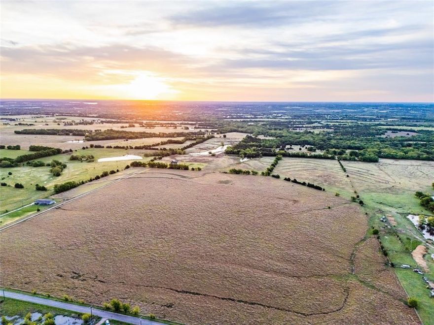 Take a look at this exceptional 68.502 acre property located in Sherman, in the heart of rapidly growing Grayson County. Situated at 950 Old Ida Rd, this tract offers a rare opportunity to secure a sizable piece of land in one of North Texas's most active expansion corridors. With clean paved road frontage, level topography, a water line and electricity along the road, this property presents a low-friction investment ready for immediate or future use. The land is primarily open pasture, allowing for maximum flexibility whether your vision is residential development, long-term holding, or strategic positioning for future growth.

The Sherman area is experiencing significant momentum as development continues to push north along the U.S. Highway 75 corridor. Recent large-scale industrial and semiconductor investments have reshaped the region's growth trajectory, increasing demand for well-located acreage. This property sits just 22 miles from Preston Harbor, the massive mixed-use development coming to Denison that is expected to bring thousands of residents, retail, and commercial activity to the region — further validating the long-term demand story for well-located Grayson County land. Tracts of this size, with accessibility and infrastructure, are becoming increasingly scarce.

Whether you're a developer, investor, or land buyer looking to get ahead of the curve, this 68.502 acre property offers a strong combination of location, usability, and long-term upside. Located just 15 minutes from Sherman, TX and approximately 1 hour and 8 minutes from DFW.