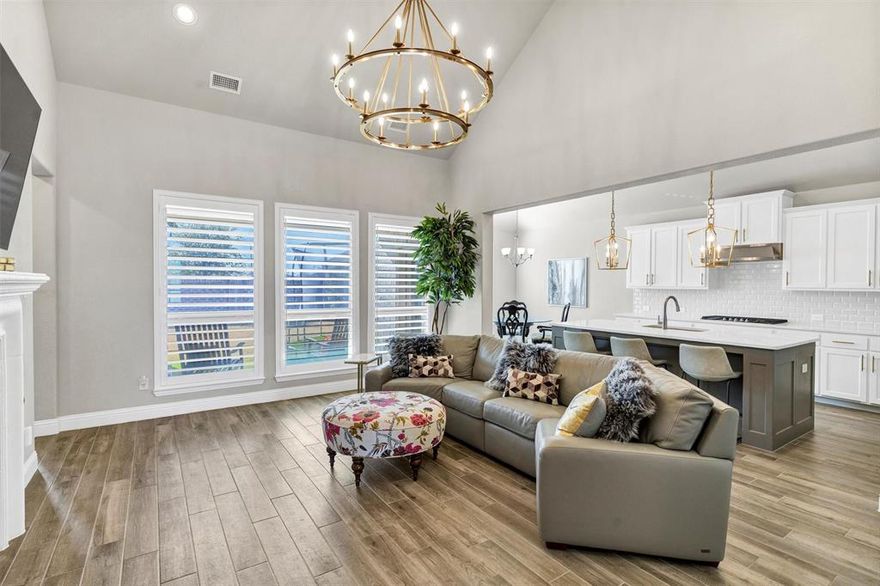 ONE STORY...MODEL HOME PERFECTION IN A PRIME SETTING! This stunning 3 bedroom, 2 bath home shows like a designer model and offers a seamless blend of luxury, comfort, and functionality. Soaring high ceilings and an open concept layout create a bright and inviting atmosphere. The chef inspired kitchen, featuring upgraded countertops, an expansive island bar, abundant custom cabinetry, and a gas cooktop, perfect for hosting gatherings or enjoying a quiet evening at home. Kitchen overlooks the warm and cozy living room with fireplace. The private primary suite is a true retreat, boasting a spa like bathroom with dual sinks, a gigantic walk in shower with bench, and an exceptionally large walk in closet. Secondary bedrooms are thoughtfully placed on a separate wing of the home, providing privacy and flexibilty for family, guests or a home office. Situated on a fully fenced yard while being conveniently located. Drone views highlight a tranquil pond with water features, adding to the neighborhoods scenic appeal. Enjoy easy access to top rated schools, major highways for an easy commute, shopping, dining, grocery stores like Kroger, and everyday conveniences. This is a rare opportunity to own a home that combines model quality finishes with a serene setting and and unbeatable loaction. Truly move in ready and unforgettable.