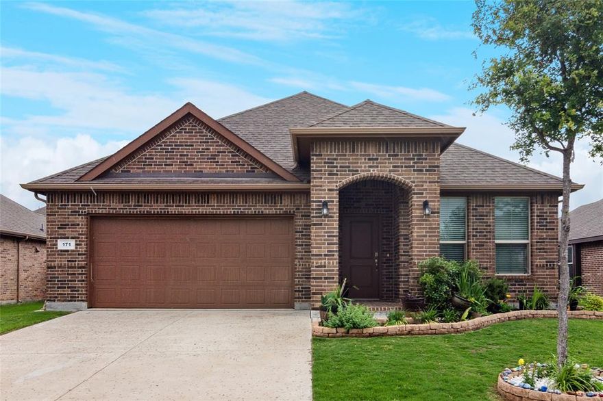 Charming single story brick home with inviting curb appeal, a landscaped yard and a cozy front porch perfect for morning coffee or evening relaxation. Inside, you'll find a move in ready interior with neutral paint and flexible living space-including a second living area that easily functions as a formal dining room or home office, or playroom. The open-concept kitchen is full of charm with granite countertops , an island with additional seating. Abundant cabinets, decorative backsplash and walk-in pantry.  The spacious living room is ideal for entertaining and flows seamlessly into the sunny breakfast nook.  The split bedroom layout offers privacy for the oversized primary suite, which features dual sinks, a garden tub, separate shower, and large walk-in closet. Additional highlights include a full size laundry room with built-in shelves and front entry two car garage. A wonderful place to call home. ***Assumable loan with a low interest rate of 5.99% available for qualified buyers***