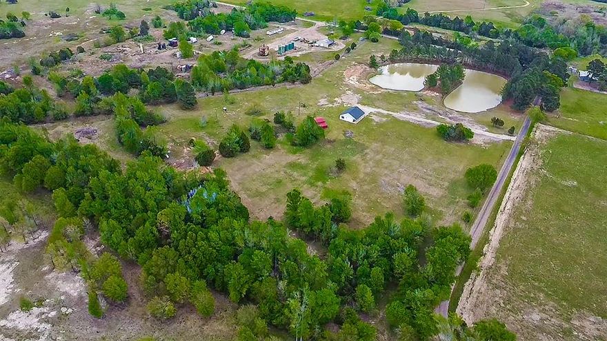 Escape to your own private retreat just under 2 hours from the DFW area in beautiful East Texas. This secluded 37+ acre property offers the perfect blend of tranquility, functionality, and opportunity.
Surrounded by nature, the land features three ponds, open grazing pastures, and an aquifer-fed water well, making it ideal for livestock, recreation, or a future homestead. Ag Exemption currently in place provides valuable tax benefits. Enjoy peaceful days fishing in the stocked pond with Bass and Catfish or take advantage of the property for hunting and outdoor activities.
Conveniently located just minutes from Lake Fork, one of Texas’ premier fishing destinations.
A 1,500 SqFt home is currently under construction, offering a unique opportunity to finish and customize to your vision. The layout has been modified to allow for a spacious 2-bedroom design with an expanded living area but could easily be adjusted back to a 3-bedroom floor plan. Framing is partially complete, giving flexibility for the next owner to make it their own. Electric service has been brought to the home by Wood County Electric Co-op, with wiring and lighting already installed. Water well is on site; home just needs connection.
Multiple ideal build sites across the property offer even more potential, whether you choose to complete the existing home, create a private estate or multi-generational setup, build additional structures, or simply enjoy the land as-is.