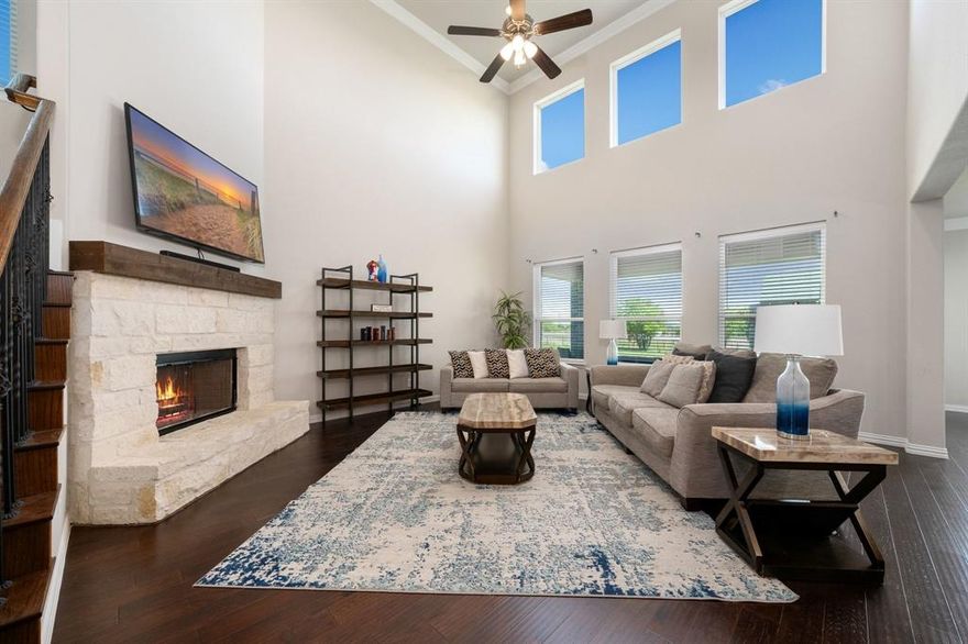 PRICED TO SELL. Due to a relocation, this is an exceptional opportunity to acquire a luxury home on a large fenced lot spanning over 1 acre at the best price per square foot in the area. Situated in the heart of Ponder, this thoughtfully designed home—just 5 years old—blends modern comfort with wide-open Texas charm. Step inside to an inviting, light-filled interior featuring simulated wood floors that flow seamlessly throughout the downstairs. The open-concept layout is crafted for everyday living and effortless entertaining. The impressive two-story family room boasts soaring ceilings and a striking gas-burning fireplace, serving as the home's dramatic focal point. This space seamlessly connects to a well-appointed kitchen, ideal for gatherings, featuring a large serving island, modern marble-like backsplash, sleek black granite countertops, and a stylish vent hood above the stove. A versatile butler’s pantry offers functionality, perfect for a wine bar or additional serving area. A private office at the front, complete with French doors, delivers an ideal work-from-home setup. The primary suite offers a sanctuary with a spacious bedroom and a spa-like bath, featuring separate vanities, a soaking tub, and a separate shower. A generous walk-in closet ensures ample storage. Secondary bedrooms provide flexibility for guests and family. Upstairs, a vast bonus room presents endless possibilities—perfect for a media room or game room. Outdoors, the backyard has been upgraded with perimeter fencing and includes a covered patio for relaxation or entertaining amidst the beauty of country living. With ample space for recreation or gardening, this property offers a rare blend of tranquility and accessibility. Conveniently located with easy access to Hwy 380, enjoy the perfect balance of rural living, just 15 minutes from city conveniences. A backyard-pool retreat with enhanced privacy rendering is available to visualize endless possibilities.