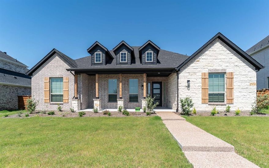 The stunning Reagan home consists of 4 bedrooms, 3 bathrooms & a covered patio!