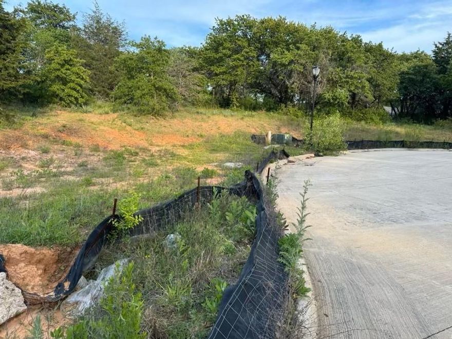 Rare opportunity to build on one of Keller’s last remaining estate-size homesites in a fully built-out, luxury residential enclave. Situated on a quiet cul-de-sac, this corner lot offers privacy, strong frontage, and mature trees—an ideal canvas for a thoughtfully designed custom home. This is the final undeveloped parcel in the neighborhood, providing long-term stability and value surrounded by established high-end residences. Bring your own builder and design without builder tie-ins. Excellent schools, a safe and peaceful setting, and convenient access to Westlake, Southlake, and major corridors throughout the Metroplex. Opportunities to build new in an established Keller neighborhood are increasingly rare. Whether for a primary residence or a custom build project, this homesite combines location, flexibility, and lasting appeal.