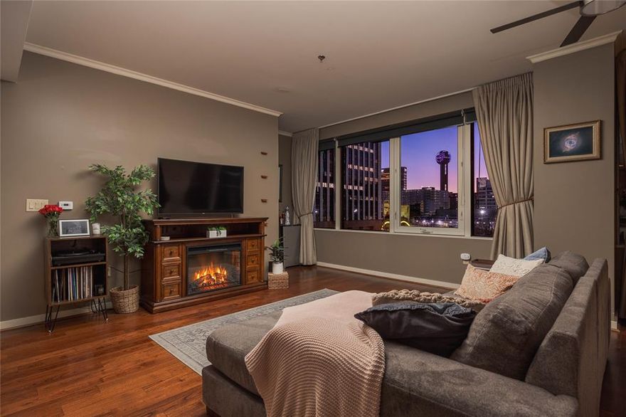 Experience elevated urban living in this spectacular third-floor corner residence with breathtaking, unobstructed views of the iconic Downtown Dallas skyline. This exceptional unit offers a rare and highly desirable layout featuring a private tandem garage and dedicated storage unit conveniently located on the same floor—just steps down the hallway. An additional secured entry door enhances privacy while providing added noise reduction from the common corridor.

Designed for both comfort and style, the open-concept floor plan seamlessly blends living, dining, and kitchen spaces—perfect for entertaining or enjoying a quiet evening overlooking the city lights. The modern kitchen is outfitted with stainless steel appliances, and the refrigerator, washer, and dryer will convey with the sale for a truly move-in-ready experience.

The spacious primary suite features dual His and Hers closets, offering generous storage and functionality. As a corner unit, natural light pours in from multiple exposures, creating a bright and inviting atmosphere throughout.

Residents enjoy access to resort-style amenities, including a stunning rooftop pool with grilling area, state-of-the-art fitness center, private movie theater, conference room, and an elegant clubhouse complete with a full kitchen—ideal for hosting gatherings. A 24-hour concierge provides convenience, security, and peace of mind.

Located in the heart of the action, this residence is just moments from the American Airlines Center, Klyde Warren Park, Victory Park shopping and dining, the Dallas Area Rapid Transit, and some of the city’s finest restaurants and entertainment venues.

This is luxury high-rise living at its finest—where convenience, privacy, and panoramic city views come together in one extraordinary opportunity.