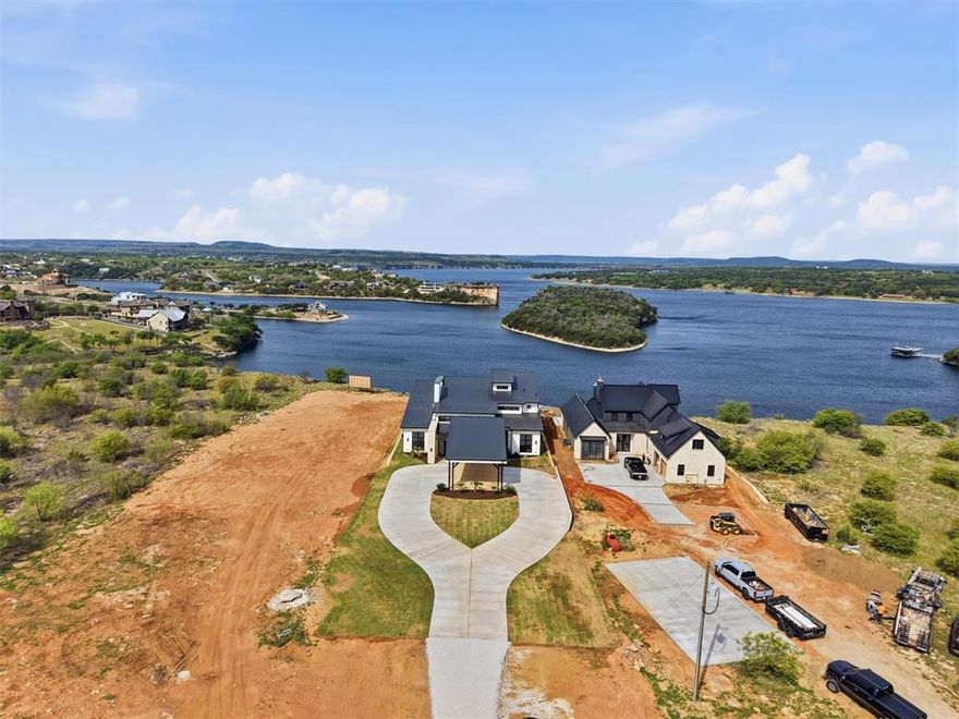 Experience refined lake living in this stunning new construction home showcasing unobstructed, panoramic views of Hell’s Gate. Thoughtfully designed with modern, clean lines and a seamless open-concept layout, this residence blends sophisticated style with effortless functionality.

The expansive living, kitchen, and dining areas are anchored by walls of glass, perfectly framing the iconic water views and filling the home with natural light. Step outside to your private pool and take in some of the most sought-after scenery on Possum Kingdom Lake.

Featuring 4 spacious bedrooms, each with its own private en suite bath, this home offers both comfort and privacy for family and guests alike. Whether you're entertaining or enjoying a quiet weekend escape, this property delivers an unmatched lakefront lifestyle.