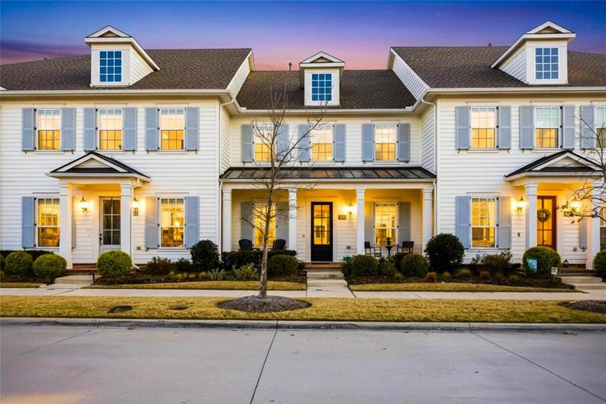 Located in the award-winning Pecan Square community, this pristine townhouse offers low-maintenance living with direct access to exceptional amenities. The open-concept layout is filled with natural light and enhanced by upgraded finishes and plantation shutters, creating a warm and inviting atmosphere. A flexible downstairs space provides the perfect option for a home office or guest room. The kitchen is designed for both everyday living and entertaining, featuring two pantries and generous storage.

Outdoor spaces include a welcoming front porch and a private back patio with a low-maintenance yard, ideal for relaxing or hosting. A two-car garage adds convenience and functionality. Ideally positioned directly across from community amenities, residents enjoy quick access to pools, parks, and year-round events. Experience comfort, style, and convenience in one of North Texas’ most desirable master-planned communities, Pecan Square.
Pecan Square Neighborhood HOA is 2260 per year.