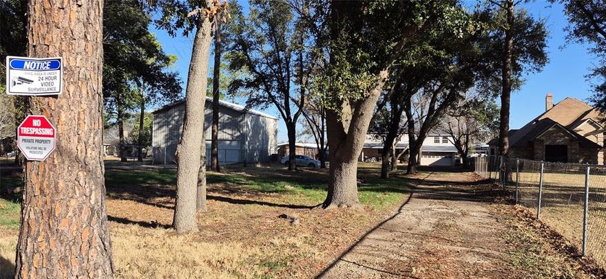 NO HOA, 1 STREET WITH GORGEOUS HOMES, AMAZING NEIGHBORS, AMAZING NEIGHBORHOOD WHERE VALUES ARE $$$$ ..GORGEOUS GORGEOUS LOT ON .796 ACRES. TONS OF TREES, BEAUTIFUL VIEWS, & MORE!! To find a lot OR HOME in ISLAND VILLAGE WATER FRONT, RIGHT AT MAIN BODY (ONE HOUSE AWAY) IS A RARE RARE FIND AT THIS PRICE! NO-ONE REALLY MOVES FROM THIS NEIGHBORHOOD, BECAUSE IT IS THAT GREAT! The house is in really really rough shape. it does have a drive thru garage, and could potentially be remodeled. Lots and lots of clean up has been done, thousands have been spent on clean up. The home needs to be gutted down to the studs if someone was to remodel this one most likely. 
TOTAL REMODEL or Tear Down & rebuild. THIS LOT, THIS LOCATION IS UNMATCHED!  Call agent for details.