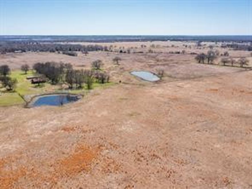 Great ranch opportunity just under an hour east of Dallas. This 114 +-acre East Texas property offers a private, secluded setting near Cedar Creek Lake. With roughly 1,450' of County Road frontage, three ponds, and cross-fencing, it’s perfect for a homesite, development, or ranching. The land is AG Exempt, outside of Kemp city limits, and has no restrictions. Please note, a floodplain runs through the property according to FEMA, and there is no survey available.

For those who enjoy golf, Kings Creek Golf Club and Pinnacle Golf Club are just a few miles away. With convenient access to both Dallas-Fort Worth International Airport and Tyler Pounds Regional Airport, the property is perfectly situated for both rural tranquility and city access.

The adjacent property at 11016 CR 2138 in Kemp, spanning approximately 210+- acres, is available for purchase. The property includes a 175' x 340'  Arena, a 4,670 SF metal building with overhangs, and equipment or hay storage. It also provides for city water and electric services.

For more details, please reach out.