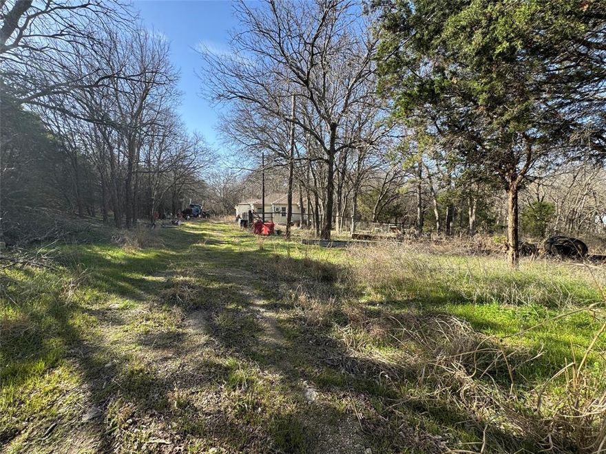 Discover the potential of 329 S Skyline Ct in Cresson, Texas—2.19 beautiful acres filled with mature trees and endless possibilities. Tucked outside city limits, this property offers the peace, privacy, and flexibility you’ve been searching for. A home has been started on-site and will require extensive renovation, or you may choose to remove it and design your own private oasis from the ground up. With traditional deed restrictions but plenty of freedom, you can bring your vision to life. Equine, cattle, goats, and lambs are welcome, making it ideal for those dreaming of a small ranch or hobby farm. Build a custom brick home, charming board and batten farmhouse, modern tiny home, or even place a mobile home—the choice is yours. 
Multiple potential build sites are scattered throughout the acreage, offering tons of privacy and scenic views beneath the canopy of trees. Whether you’re looking to invest, build, or create a secluded retreat, this property is ready for your imagination to take the lead.