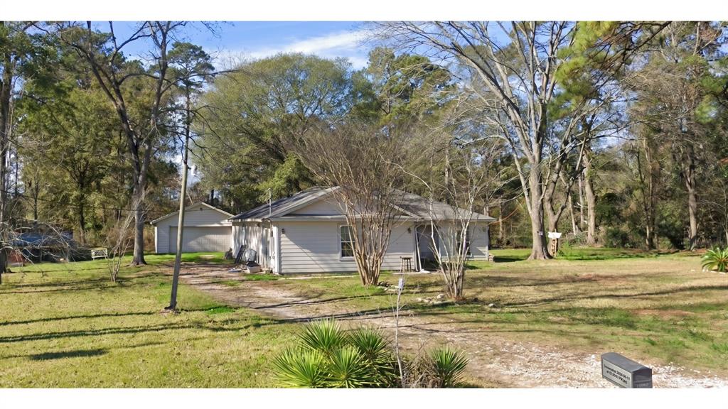 Photo of 12400 Cole Drive, Cleveland, TX 77328 (MLS # 21301153)