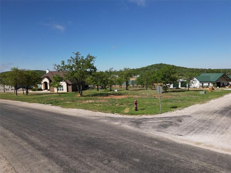 Discover the perfect opportunity to build your dream home on this beautiful lakefront lot, offering breathtaking water views, peaceful surroundings, and direct access to the lake.  Nestled in a quiet and scenic area, this property provides the ideal setting for a full-time residence, vacation getaway, or investment property.  This spacious lot features gently sloping terrain that leads down to the shoreline, making it perfect for building a custom home with panoramic lake views.  Mature trees provide privacy and shade while still allowing plenty of open space for construction.  Imagine waking up each morning to sparkling water views and enjoying sunsets over the lake from your future porch or deck.  The property offers easy access to boating, fishing, kayaking, and other water activities right from your backyard.