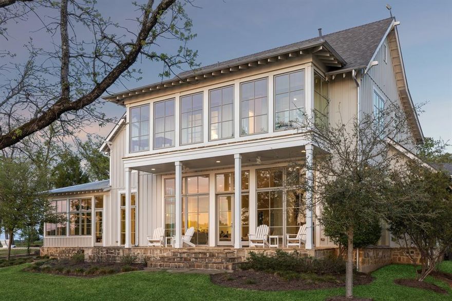 Perched on an oversized homesite in the coveted Founder’s Row at Long Cove, this fully furnished lakefront retreat delivers 180-degree open water views and effortless luxury. Low Country-inspired architecture offers 5,538 AC SQ. FT of stylish, light-filled living space—including two master suites, a perfectly outfitted game room, and a detached 330 SQ. FT guest suite above the garage.

Inside, modern finishes complement the open-concept floorplan and expansive entertaining spaces, while outside, a private boat and golf cart are included so you’re ready to explore from day one.  Steps from the Lake Club and convenient to all the amenities Long Cove offers, this lake home is the perfect retreat for year-round memories with family and friends.