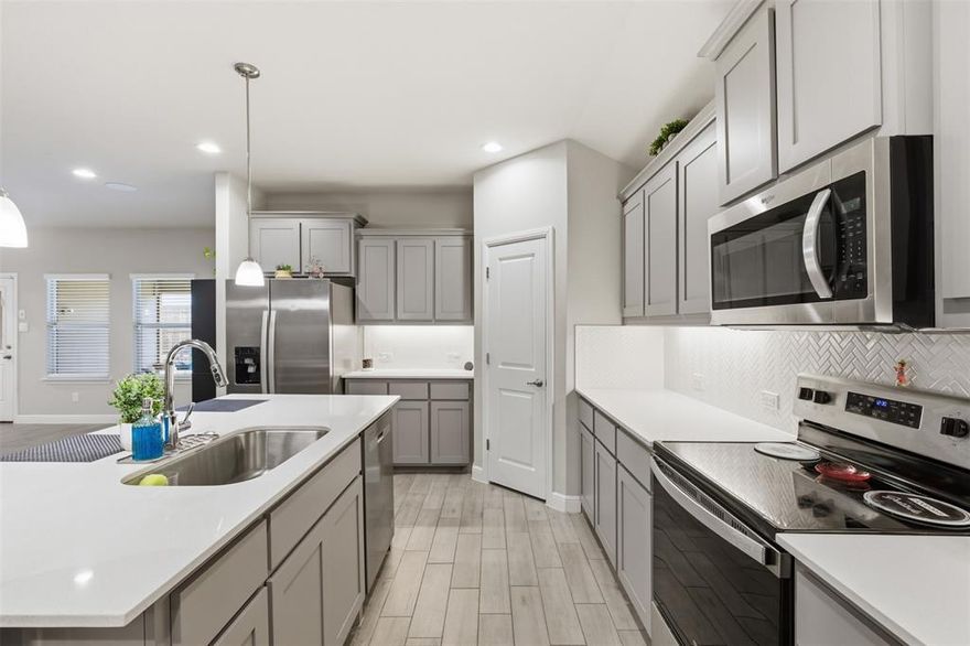 Built in 2024 and barely lived in, this beautifully maintained 5-bedroom, 3-bath brick home offers the feel of new construction—without the wait.
Situated on a desirable corner lot in a growing neighborhood within the highly sought-after Burleson ISD, this home combines space, functionality, and modern finishes in an ideal location with quick access to I-35. Inside, you’ll find an open-concept layout designed for both everyday living and entertaining. The spacious living area features built-in wired speakers, flowing seamlessly into a well-appointed kitchen with quartz countertops, shaker-style cabinetry, a large island, and an oversized pantry. The private primary suite is generously sized with abundant natural light, a walk-in shower, and an expansive walk-in closet. Four additional bedrooms offer ample space and storage, while a flexible bonus room can easily serve as a home office, playroom, or even a 6th bedroom. Additional highlights include tile flooring throughout main living areas, carpeted bedrooms, a large laundry room, and a covered back patio perfect for relaxing or entertaining. The backyard is low-maintenance yet functional for everyday enjoyment.
A rare opportunity to own a nearly new home with space, versatility, and upgrades already in place.