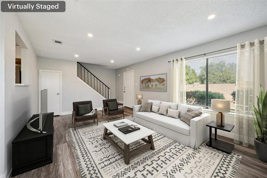 Beautifully updated and move-in ready, this charming condo features a light, open, and airy floorplan filled with natural light. At the heart of the home, the spacious living room boasts a cozy wood-burning brick fireplace and opens seamlessly to the dining area with sliding glass doors to the private patio. The well-equipped kitchen offers ample cabinet and counter space, sleek appliances, and white Corian countertops. A convenient half bath and laundry area are also located downstairs. Upstairs, you’ll find three comfortable bedrooms and a full bath. This home has been meticulously maintained with fresh paint throughout, new laminate wood flooring downstairs, a recently replaced sliding glass door, and thoughtful updates including a roof replaced in 2019, a water heater less than a year old, and modern finishes throughout. The stainless steel refrigerator, washer, and dryer all convey with purchase, making this condo truly move-in ready. Ideally located with quick access to Firewheel Mall, Central Expressway-75, and LBJ-635), plus proximity to both Richardson and Dallas, this home offers convenience and comfort in one package. Schedule your private showing today and don’t miss this wonderful opportunity!