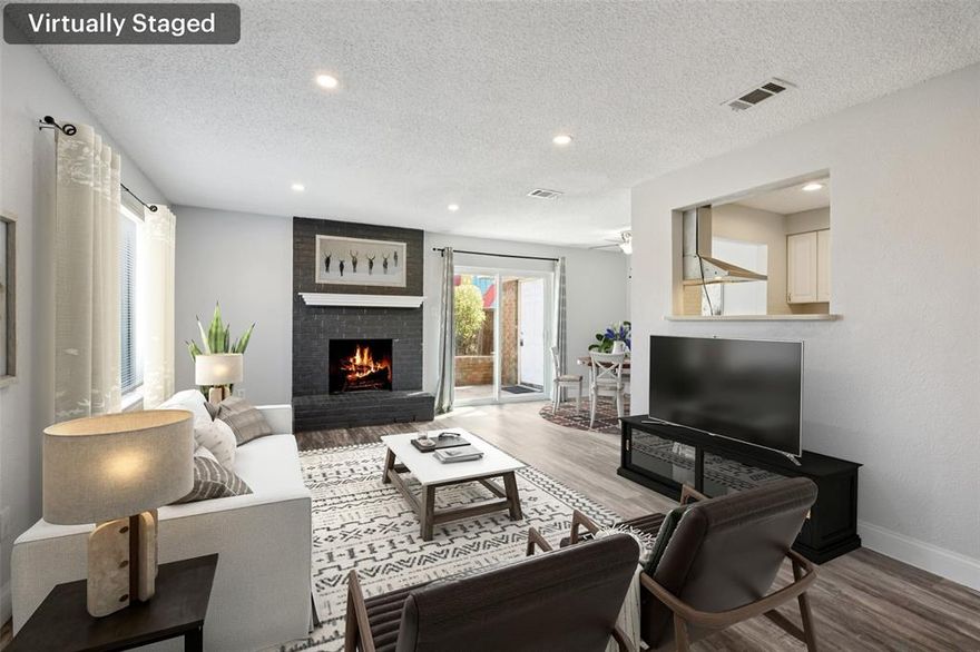 RARE 3-Bedroom Condo — Own for Less Than Rent. Beautifully updated and move-in ready, this charming condo features a light, open, and airy floorplan filled with natural light. At the heart of the home, the spacious living room boasts a cozy wood-burning brick fireplace and opens seamlessly to the dining area with sliding glass doors to the private patio. The well-equipped kitchen offers ample cabinet and counter space, sleek appliances, and white Corian countertops. A convenient half bath and laundry area are also located downstairs. Upstairs, you’ll find three comfortable bedrooms and a full bath. This home has been meticulously maintained with fresh paint throughout, new laminate wood flooring downstairs, a recently replaced sliding glass door, and thoughtful updates including a roof replaced in 2019, a water heater less than a year old, and modern finishes throughout. The stainless steel refrigerator, washer, and dryer all convey with purchase, making this condo truly move-in ready. Ideally located with quick access to Firewheel Mall, Central Expressway-75, and LBJ-635), plus proximity to both Richardson and Dallas, this home offers convenience and comfort in one package. Schedule your private showing today and don’t miss this wonderful opportunity! HOA covers trash, not water.