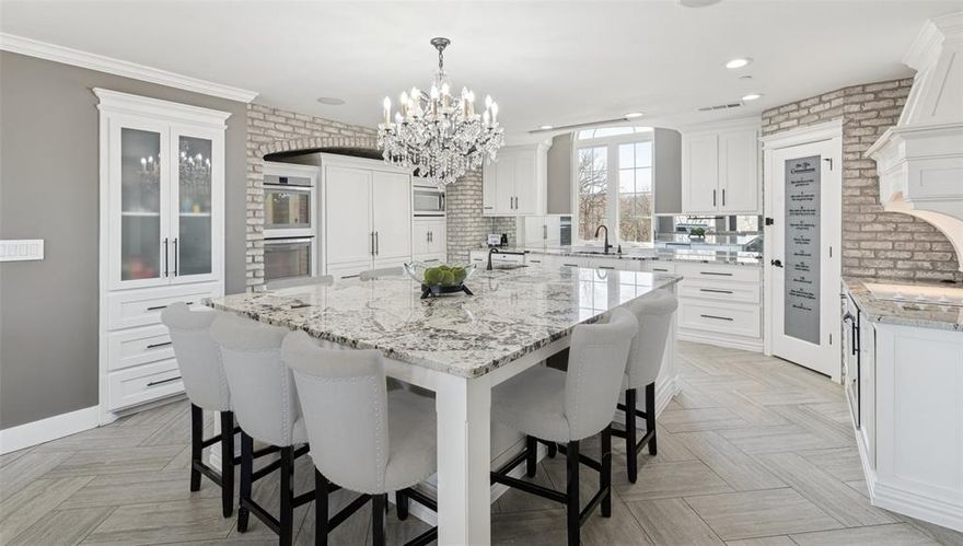 Luxury acreage in Keller ISD with subdivision and second-home potential, 9204 Indian Knoll Trail sits on nearly four private acres in Keller, Texas, offering elevated views, exceptional privacy, and a rare rural-estate feel just minutes from shopping, dining, and major access routes. Located on a street defined by large-acreage properties, this hilltop setting provides space, separation, and flexibility that are increasingly difficult to find.

The four-bedroom, three-bath custom residence was fully remodeled in recent years and offers a spacious, light-filled layout with expansive windows framing treetop views throughout. While the architecture reflects a bold, distinctive design, the home is functional and well-maintained, with opportunities for selective finish updates rather than structural renovation.

The true differentiator is the land. With nearly four acres of elevated terrain, the property presents multiple future possibilities — including the potential for a secondary residence or subdivision (buyer to verify). A long private drive, mature trees, and natural topography create a sense of seclusion while maintaining proximity to everyday conveniences and top-rated Keller ISD schools.

A detached oversized garage provides additional flexibility for storage, workshop, fitness, or hobby use. Whether held as a private estate, multi-generational property, or long-term investment, this offering is best suited for buyers who value acreage, privacy, school quality, and future optionality over cookie-cutter design.

This is a rare opportunity to secure luxury land in Keller with acreage, elevation, and development flexibility — a property defined by potential, not replication.