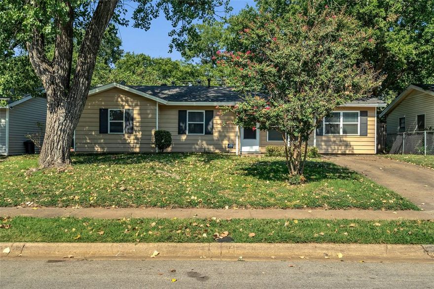 Charming 3-bedroom, 1-bath home in the highly acclaimed HEB-ISD! Featuring neutral colors throughout, a spacious layout, and a large backyard, this property is ready for you to move in and make it your own. The inviting 17x12 family room boasts a wood-burning stone fireplace and opens to a dedicated dining area—perfect for gatherings. The open kitchen offers plenty of storage, attractive cabinetry, a tiled backsplash, built-in microwave, gas stove, and refrigerator.  
You’ll find nicely sized bedrooms, a cheerful full bath, and a full-size utility room with washer and dryer included. Step outside to enjoy the huge backyard with mature trees, a covered patio, and a 9x11 storage building with a concrete floor. Conveniently located within walking distance to North Euless Elementary and Trinity High Schools. Just 2 blocks from Midway Park, where City of Euless fitness center, aquatic center, rec center and senior center are located!  New roof just installed 8-8-2025. Updated vinyl windows.  Buyers termination was not related to the inspection.