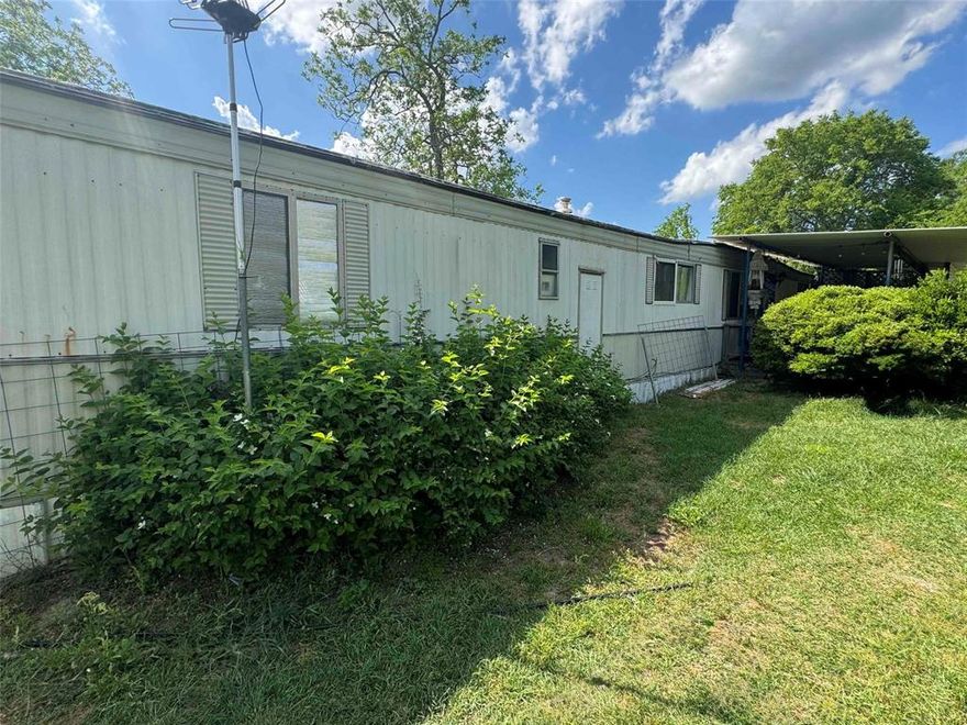 On the outskirts of Gladewater this 2 acre mini farm is ready for its newest owner. Completely fenced, with city utilities, its country living with small town convenience. The 840 sq ft single wide has the cutest front porch but does need updates and some repairs. There is also an adorable unfinished mini home with porch on the property also for added space.
